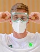 10 July 2021; Team Ireland swimmer Shane Ryan, wearing a face mask and protective eye goggles, at Dublin Airport on their departure for the Tokyo 2020 Olympic Games. Photo by Ramsey Cardy/Sportsfile