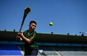 10 July 2021; Young Antrim supporter Fionn McCallum, from Belfast, pucks a sliotar on the pitch before the GAA Hurling All-Ireland Senior Championship preliminary round match between Antrim and Laois at Parnell Park in Dublin. Photo by Seb Daly/Sportsfile