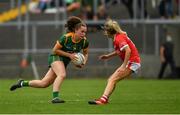 10 July 2021; Emma Duggan of Meath in action against Orla Finn of Cork  during the TG4 All-Ireland Senior Ladies Football Championship Group 2 Round 1 match between Cork and Meath at St Brendan's Park in Birr, Offaly. Photo by Ray McManus/Sportsfile