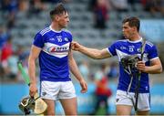 10 July 2021; Paddy Purcell of Laois, left, is congratulated by team-mate PJ Scully after scoring his side's first goal, as they return to the dressing rooms for half time, during the GAA Hurling All-Ireland Senior Championship preliminary round match between Antrim and Laois at Parnell Park in Dublin. Photo by Seb Daly/Sportsfile