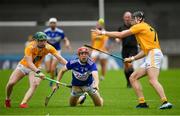10 July 2021; Fiachra Fennell of Laois in action against Conal Cunning, left, and Aodhan O’Brien of Antrim during the GAA Hurling All-Ireland Senior Championship preliminary round match between Antrim and Laois at Parnell Park in Dublin. Photo by Seb Daly/Sportsfile