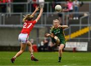 10 July 2021; Orlagh Lally of Meath kicks ahead of Daire Kiely of Cork during the TG4 All-Ireland Senior Ladies Football Championship Group 2 Round 1 match between Cork and Meath at St Brendan's Park in Birr, Offaly. Photo by Ray McManus/Sportsfile