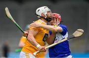 10 July 2021; Neil McManus of Antrim in action against Fiachra Fennell of Laois during the GAA Hurling All-Ireland Senior Championship preliminary round match between Antrim and Laois at Parnell Park in Dublin. Photo by Seb Daly/Sportsfile