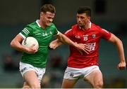 10 July 2021; Brian Donovan of Limerick in action against Daniel Dineen of Cork during the Munster GAA Football Senior Championship Semi-Final match between Limerick and Cork at the LIT Gaelic Grounds in Limerick. Photo by Harry Murphy/Sportsfile