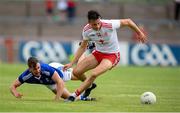 10 July 2021; Paul Donaghy of Tyrone in action against Brian O'Connell of Cavan during the Ulster GAA Football Senior Championship quarter-final match between Tyrone and Cavan at Healy Park in Omagh, Tyrone. Photo by Stephen McCarthy/Sportsfile
