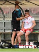 10 July 2021; Richard Donnelly of Tyrone receives medical attention during the Ulster GAA Football Senior Championship quarter-final match between Tyrone and Cavan at Healy Park in Omagh, Tyrone. Photo by Stephen McCarthy/Sportsfile