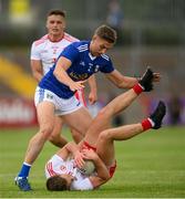 10 July 2021; Niall Sludden of Tyrone in action against Killian Clarke of Cavan during the Ulster GAA Football Senior Championship quarter-final match between Tyrone and Cavan at Healy Park in Omagh, Tyrone. Photo by Stephen McCarthy/Sportsfile
