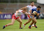 10 July 2021; Conor Smith of Cavan in action against Peter Harte, left, and Tiernan McCann of Tyrone during the Ulster GAA Football Senior Championship quarter-final match between Tyrone and Cavan at Healy Park in Omagh, Tyrone. Photo by Stephen McCarthy/Sportsfile