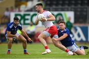 10 July 2021; Pádraig Hampsey of Tyrone in action against Oisin Pierson of Cavan during the Ulster GAA Football Senior Championship quarter-final match between Tyrone and Cavan at Healy Park in Omagh, Tyrone. Photo by Stephen McCarthy/Sportsfile