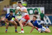 10 July 2021; Pádraig Hampsey of Tyrone in action against Oisin Pierson of Cavan during the Ulster GAA Football Senior Championship quarter-final match between Tyrone and Cavan at Healy Park in Omagh, Tyrone. Photo by Stephen McCarthy/Sportsfile