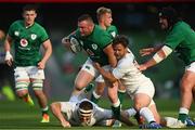 10 July 2021; Dave Kilcoyne of Ireland is tackled by Paul Mullen, left, and Calvin Whiting of USA during the International Rugby Friendly match between Ireland and USA at the Aviva Stadium in Dublin. Photo by Ramsey Cardy/Sportsfile