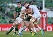 10 July 2021; James Hume of Ireland is tackled by Luke Carty, left, and Cam Dolan of USA during the International Rugby Friendly match between Ireland and USA at the Aviva Stadium in Dublin. Photo by Brendan Moran/Sportsfile