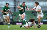 10 July 2021; Dave Kilcoyne of Ireland evades the tackle of Mika Kruse, left, and Ruben de Haas of USA during the International Rugby Friendly match between Ireland and USA at the Aviva Stadium in Dublin. Photo by Ramsey Cardy/Sportsfile