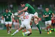 10 July 2021; James Ryan of Ireland offloads from the tackle by Luke Carty of USA during the International Rugby Friendly match between Ireland and USA at the Aviva Stadium in Dublin. Photo by Ramsey Cardy/Sportsfile
