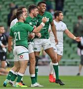10 July 2021; Hugo Keenan of Ireland celebrates with team-mates Caolin Blade, left, and Robert Baloucoune after scoring their side's eighth try during the International Rugby Friendly match between Ireland and USA at the Aviva Stadium in Dublin. Photo by Brendan Moran/Sportsfile