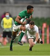 10 July 2021; Robert Baloucoune of Ireland evades the tackle of Will Magie of USA during the International Rugby Friendly match between Ireland and USA at the Aviva Stadium in Dublin. Photo by Ramsey Cardy/Sportsfile