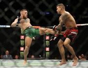 10 July 2021; Conor McGregor, left, and Dustin Poirier in their lightweight fight during the UFC 264 event at T-Mobile Arena in Las Vegas, Nevada, USA. Photo by Thomas King/Sportsfile
