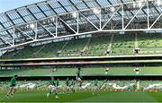 10 July 2021; The Ireland team run onto the pitch in front of a small socially distanced crowd before the International Rugby Friendly match between Ireland and USA at the Aviva Stadium in Dublin. Photo by Brendan Moran/Sportsfile