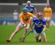 10 July 2021; Fiachra Fennell of Laois in action against Conal Cunning of Antrim during the GAA Hurling All-Ireland Senior Championship preliminary round match between Antrim and Laois at Parnell Park in Dublin. Photo by Seb Daly/Sportsfile