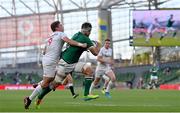 10 July 2021; Caelan Doris of Ireland is tackled by Ruben de Haas of USA during the International Rugby Friendly match between Ireland and USA at the Aviva Stadium in Dublin. Photo by Ramsey Cardy/Sportsfile