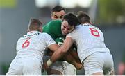 10 July 2021; James Ryan of Ireland is tackled by Hanco Germishuys, left, and Cam Dolan of USA during the International Rugby Friendly match between Ireland and USA at the Aviva Stadium in Dublin. Photo by Ramsey Cardy/Sportsfile