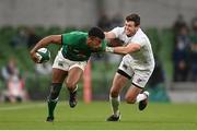 10 July 2021; Robert Baloucoune of Ireland is tackled by Will Magie of USA during the International Rugby Friendly match between Ireland and USA at the Aviva Stadium in Dublin. Photo by Ramsey Cardy/Sportsfile