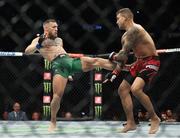 10 July 2021; Conor McGregor, left, and Dustin Poirier in their lightweight fight during the UFC 264 event at T-Mobile Arena in Las Vegas, Nevada, USA. Photo by Thomas King/Sportsfile