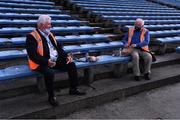 3 July 2021; 'Maors' Mick Mackey, left, and Mattie Finnerty, from Cashel, enjoy a spot of lunch before taking their posts in advance of the Munster GAA Hurling Senior Championship Semi-Final match between Cork and Limerick at Semple Stadium in Thurles, Tipperary.  Photo by Ray McManus/Sportsfile