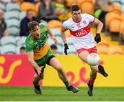 11 July 2021; Ciaran McFaul of Derry in action against Hugh McFadden of Donegal during the Ulster GAA Football Senior Championship Quarter-Final match between Derry and Donegal at Páirc MacCumhaill in Ballybofey, Donegal. Photo by Stephen McCarthy/Sportsfile