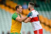 11 July 2021; Neil McGee of Donegal and Niall Loughlin of Derry during the Ulster GAA Football Senior Championship Quarter-Final match between Derry and Donegal at Páirc MacCumhaill in Ballybofey, Donegal. Photo by Stephen McCarthy/Sportsfile