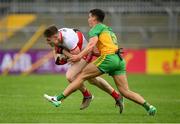 11 July 2021; Ethan Doherty of Derry in action against Odhran McFadden Ferry of Donegal during the Ulster GAA Football Senior Championship Quarter-Final match between Derry and Donegal at Páirc MacCumhaill in Ballybofey, Donegal. Photo by Stephen McCarthy/Sportsfile