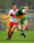 11 July 2021; Ryan McHugh of Donegal is tackled by Shane McGuigan of Derry during the Ulster GAA Football Senior Championship Quarter-Final match between Derry and Donegal at Páirc MacCumhaill in Ballybofey, Donegal. Photo by Stephen McCarthy/Sportsfile