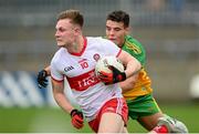 11 July 2021; Ethan Doherty of Derry in action against Odhran McFadden Ferry of Donegal during the Ulster GAA Football Senior Championship Quarter-Final match between Derry and Donegal at Páirc MacCumhaill in Ballybofey, Donegal. Photo by Stephen McCarthy/Sportsfile