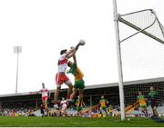 11 July 2021; Benny Heron of Derry has an attempt on goal, despite the attention of Eoin McHugh of Donegal, in the second half, which was adjudged not to have crossed the line, during the Ulster GAA Football Senior Championship Quarter-Final match between Derry and Donegal at Páirc MacCumhaill in Ballybofey, Donegal. Photo by Stephen McCarthy/Sportsfile