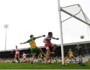 11 July 2021; Benny Heron of Derry has an attempt on goal, despite the attention of Eoin McHugh of Donegal, in the second half, which was adjudged not to have crossed the line, during the Ulster GAA Football Senior Championship Quarter-Final match between Derry and Donegal at Páirc MacCumhaill in Ballybofey, Donegal. Photo by Stephen McCarthy/Sportsfile