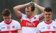 11 July 2021; Dejected Derry players, from left, Ethan Doherty, Padraig Cassidy and Shea Downey following the Ulster GAA Football Senior Championship Quarter-Final match between Derry and Donegal at Páirc MacCumhaill in Ballybofey, Donegal. Photo by Stephen McCarthy/Sportsfile