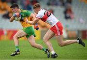 11 July 2021; Ryan McHugh of Donegal in action against Oisin McWilliams of Derry during the Ulster GAA Football Senior Championship Quarter-Final match between Derry and Donegal at Páirc MacCumhaill in Ballybofey, Donegal. Photo by Stephen McCarthy/Sportsfile