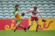 11 July 2021; Odhran Mac Niallais of Donegal in action against Brendan Rogers of Derry during the Ulster GAA Football Senior Championship Quarter-Final match between Derry and Donegal at Páirc MacCumhaill in Ballybofey, Donegal. Photo by Stephen McCarthy/Sportsfile