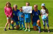 10 July 2021; DLR Waves players Avril Brierley, left, and Katie Bardis with young supporters before the SSE Airtricity Women's National League match between DLR Waves and Cork City at UCD Bowl in Belfield, Dublin. Photo by Ben McShane/Sportsfile