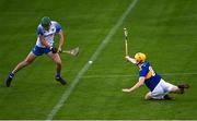 12 July 2021; Michael Kiely of Waterford shoots to score his side's first goal, under pressure from Conor O'Dwyer of Tipperary, during the Munster GAA Hurling U20 Championship Quarter-Final match between Tipperary and Waterford at Semple Stadium in Thurles, Tipperary. Photo by Piaras Ó Mídheach/Sportsfile