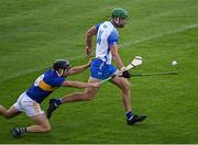 12 July 2021; Michael Kiely of Waterford gets past Max Hackett of Tipperary during the Munster GAA Hurling U20 Championship Quarter-Final match between Tipperary and Waterford at Semple Stadium in Thurles, Tipperary. Photo by Piaras Ó Mídheach/Sportsfile