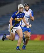 12 July 2021; Devon Ryan of Tipperary gets past Kevin Mahony of Waterford during the Munster GAA Hurling U20 Championship Quarter-Final match between Tipperary and Waterford at Semple Stadium in Thurles, Tipperary. Photo by Piaras Ó Mídheach/Sportsfile