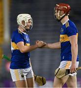 12 July 2021; Tipperary players Devon Ryan, left, and Seán Hayes celebrate after their side's victory in the Munster GAA Hurling U20 Championship Quarter-Final match between Tipperary and Waterford at Semple Stadium in Thurles, Tipperary. Photo by Piaras Ó Mídheach/Sportsfile