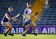 12 July 2021; Cathrach Daly of Waterford in action against James Devanney of Tipperary during the Munster GAA Hurling U20 Championship Quarter-Final match between Tipperary and Waterford at Semple Stadium in Thurles, Tipperary. Photo by Piaras Ó Mídheach/Sportsfile