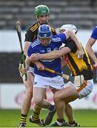 13 July 2021; Mark Hennessy of Laois is fouled by Peter McDonald, left, and Jamie Young of Kilkenny, resulting in a penalty during the Leinster U20 Hurling Championship Quarter-Final match between Kilkenny and Laois at UPMC Nowlan Park in Kilkenny. Photo by Sam Barnes/Sportsfile