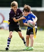 14 July 2021; Jack Wilson is tackled by Fionn Kiernan during the Bank of Ireland Leinster Rugby Summer Camp at Terenure College RFC in Dublin. Photo by Harry Murphy/Sportsfile