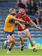 14 July 2021; Tadhg O’Connell of Cork is tackled by Diarmuid Stritch of Clare during the 2021 Electric Ireland Munster GAA Hurling Minor Championship Quarter-Final match between Clare and Cork at Semple Stadium in Thurles, Tipperary. Photo by Eóin Noonan/Sportsfile