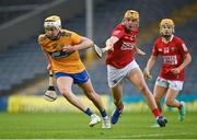 14 July 2021; Sean Rynne of Clare in action against Cillian Tobin of Cork during the 2021 Electric Ireland Munster GAA Hurling Minor Championship Quarter-Final match between Clare and Cork at Semple Stadium in Thurles, Tipperary. Photo by Eóin Noonan/Sportsfile