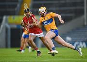 14 July 2021; Sean Rynne of Clare in action against Mikey Finn of Cork during the 2021 Electric Ireland Munster GAA Hurling Minor Championship Quarter-Final match between Clare and Cork at Semple Stadium in Thurles, Tipperary. Photo by Eóin Noonan/Sportsfile