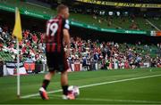 15 July 2021; Supporters look on as Tyreke Wilson of Bohemians prepares to take a corner during the UEFA Europa Conference League first qualifying round second leg match between Bohemians and Stjarnan at the Aviva Stadium in Dublin. Photo by Harry Murphy/Sportsfile